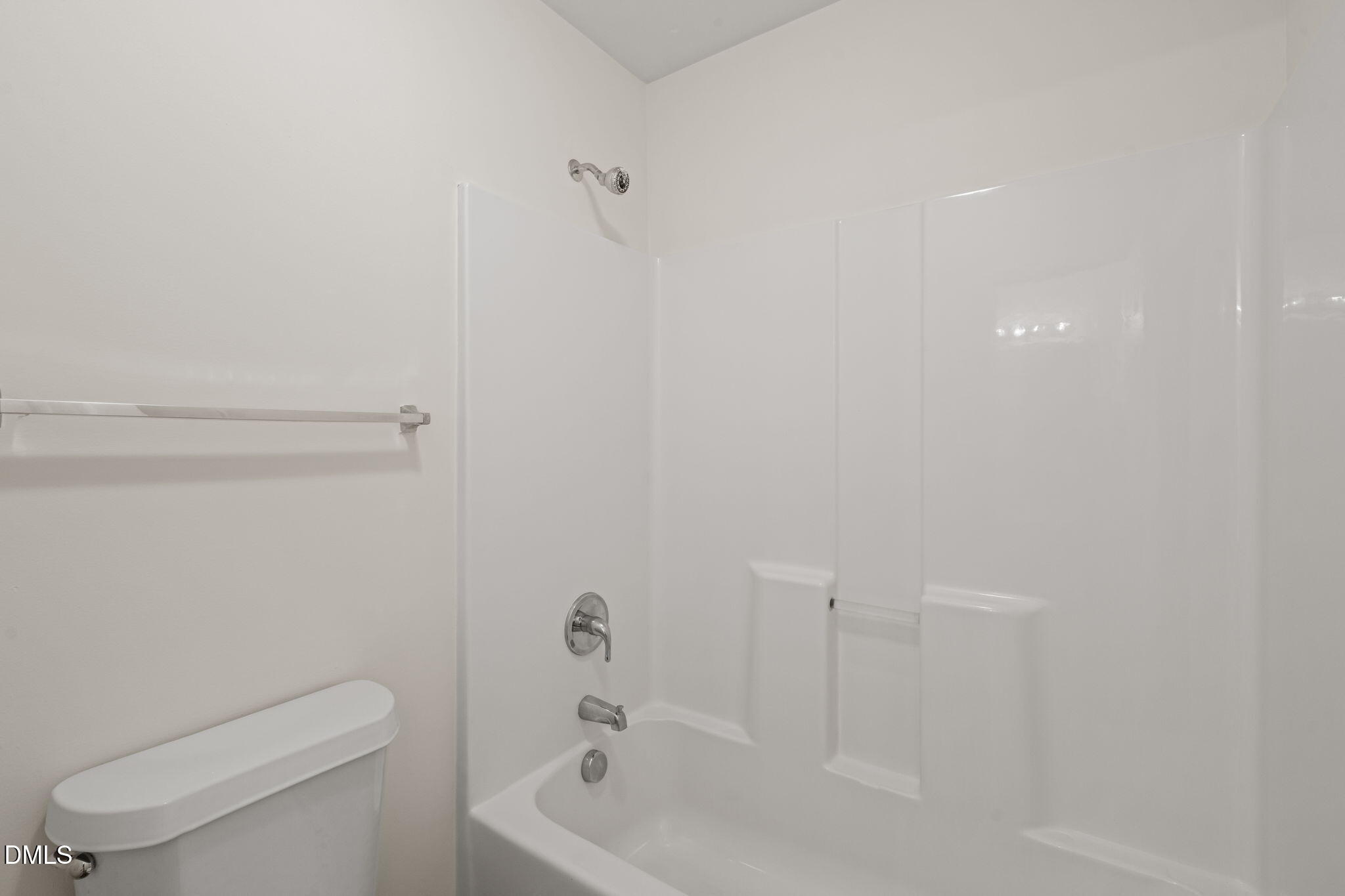 3207 Geary Trail Raleigh, NC 27610 - Photo 30 of 55 a bathroom with a toilet and a bathtub