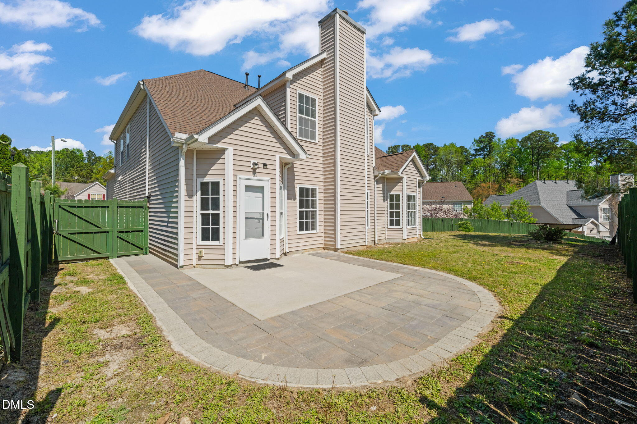 3207 Geary Trail Raleigh, NC 27610 - Photo 40 of 55 a view of a white house with a yard and potted plants