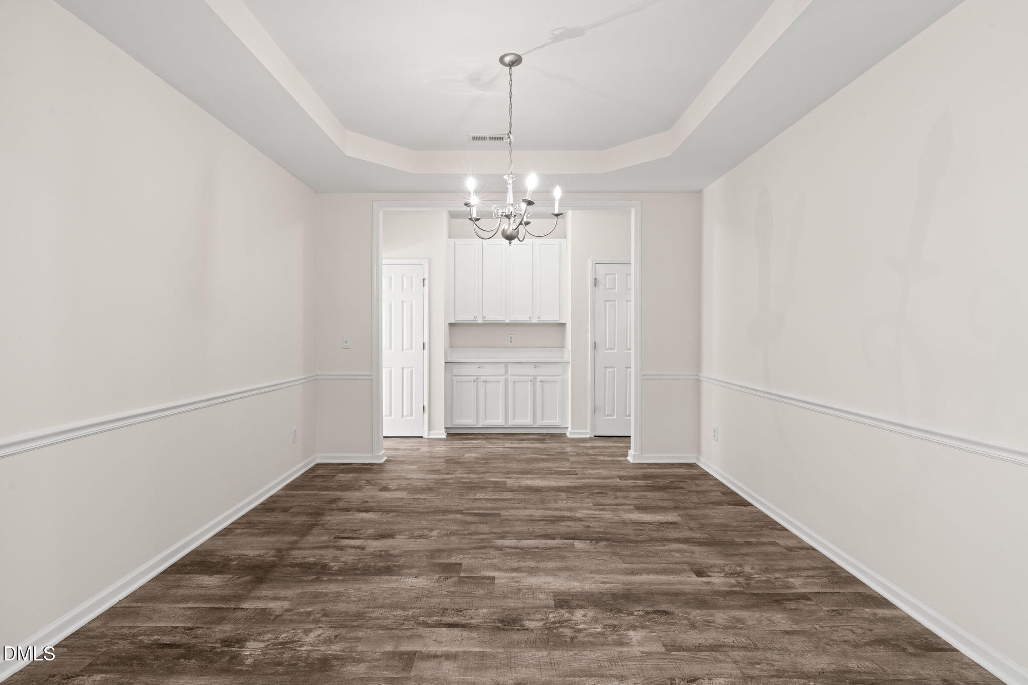 3207 Geary Trail Raleigh, NC 27610 - Photo 8 of 55 a view of a hallway with a chandelier and entryway