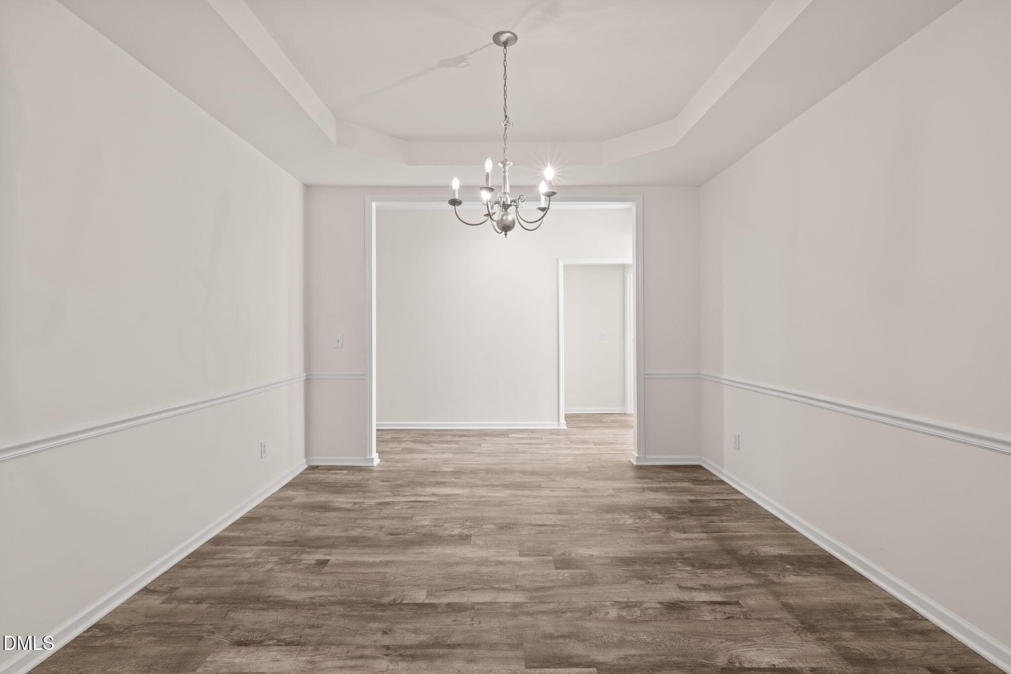 3207 Geary Trail Raleigh, NC 27610 - Photo 9 of 55 a view of a chandelier in an empty room