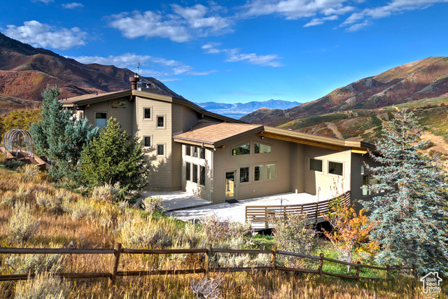 152 Silver Oak Road Salt Lake City, UT 84108 - Photo 1 of 1 Back of property featuring a patio area and a mountain view