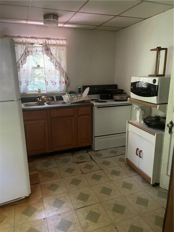 106 Graham Road Slippery Rock, PA 16057 - Photo 4 of 5 a kitchen with a stove and a refrigerator
