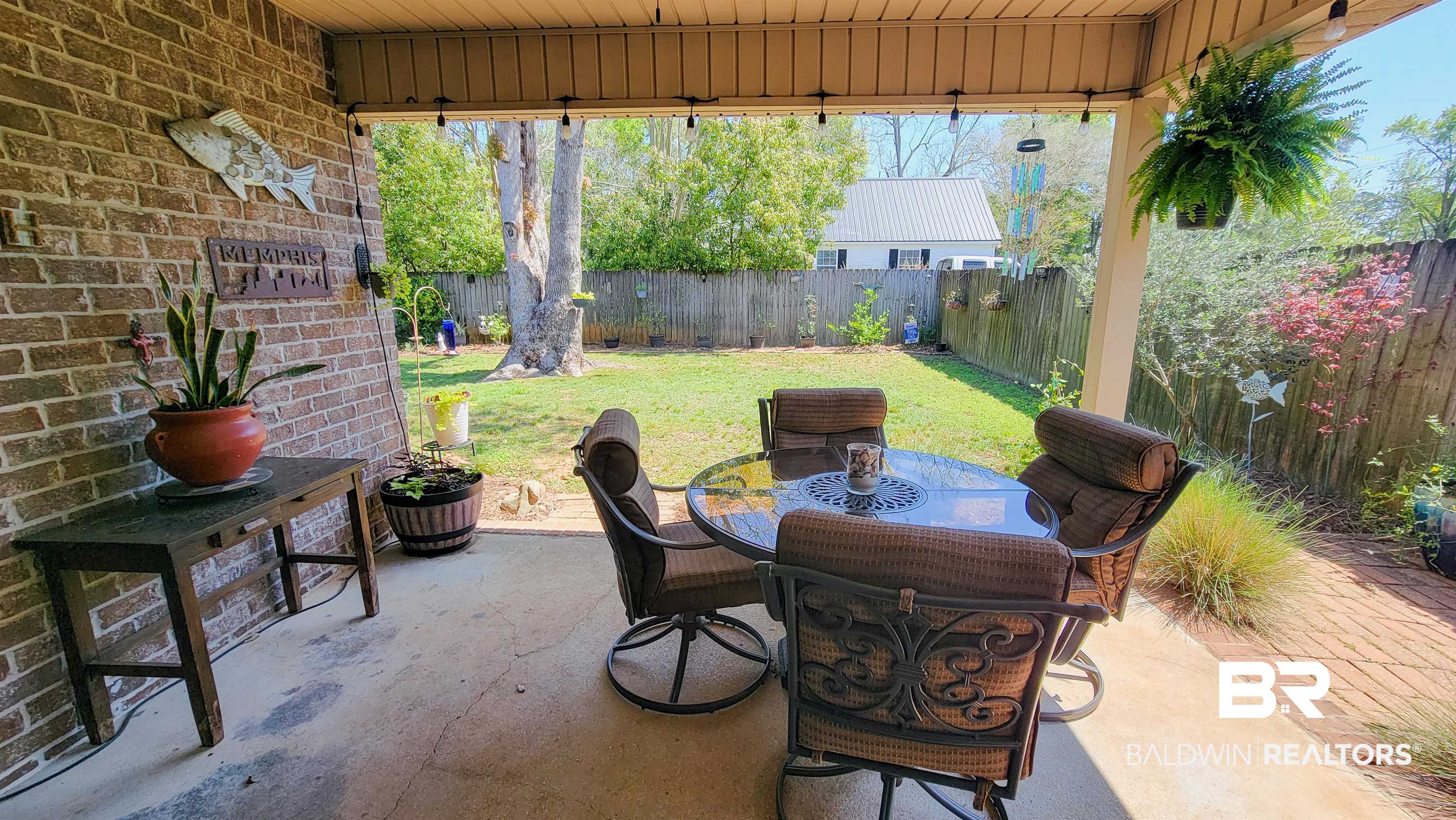 1304 Majesty Loop Foley, AL 36535 - Photo 24 of 44 Fenced backyard with a patio area and outdoor dining area
