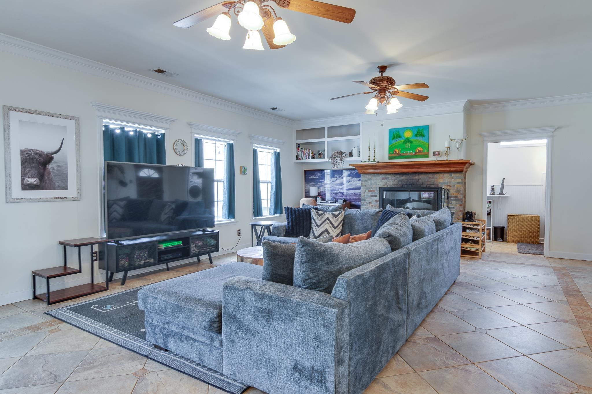 4019 Fonta Road Bartlett, TN 38135 - Photo 25 of 39 a living room with furniture a flat screen tv and a chandelier