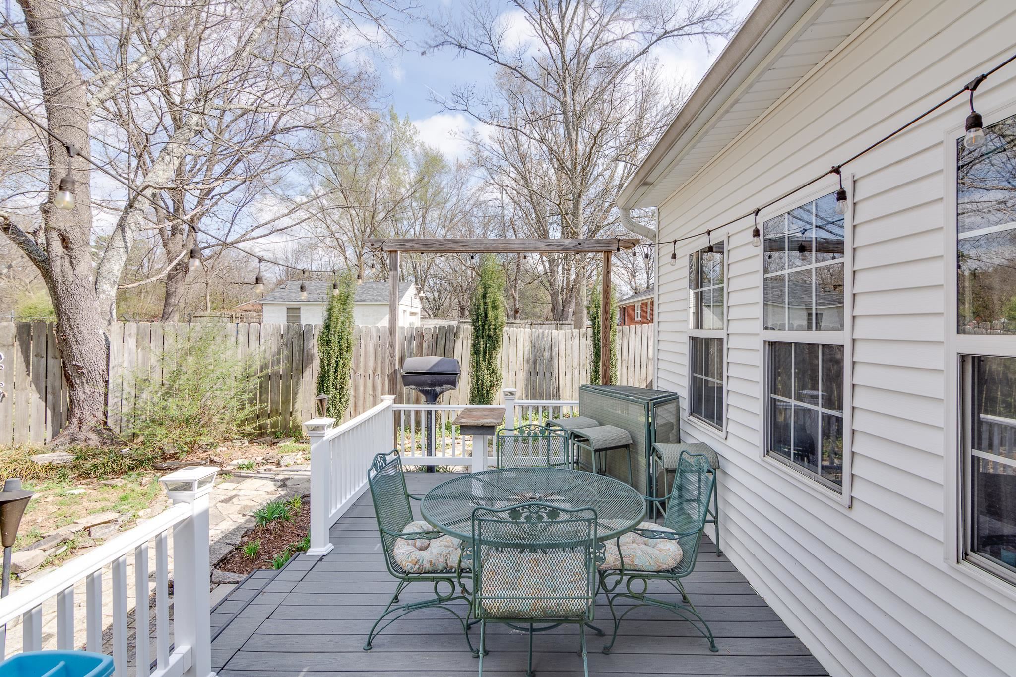4019 Fonta Road Bartlett, TN 38135 - Photo 33 of 39 a view of a patio with couches table and chairs and wooden floor