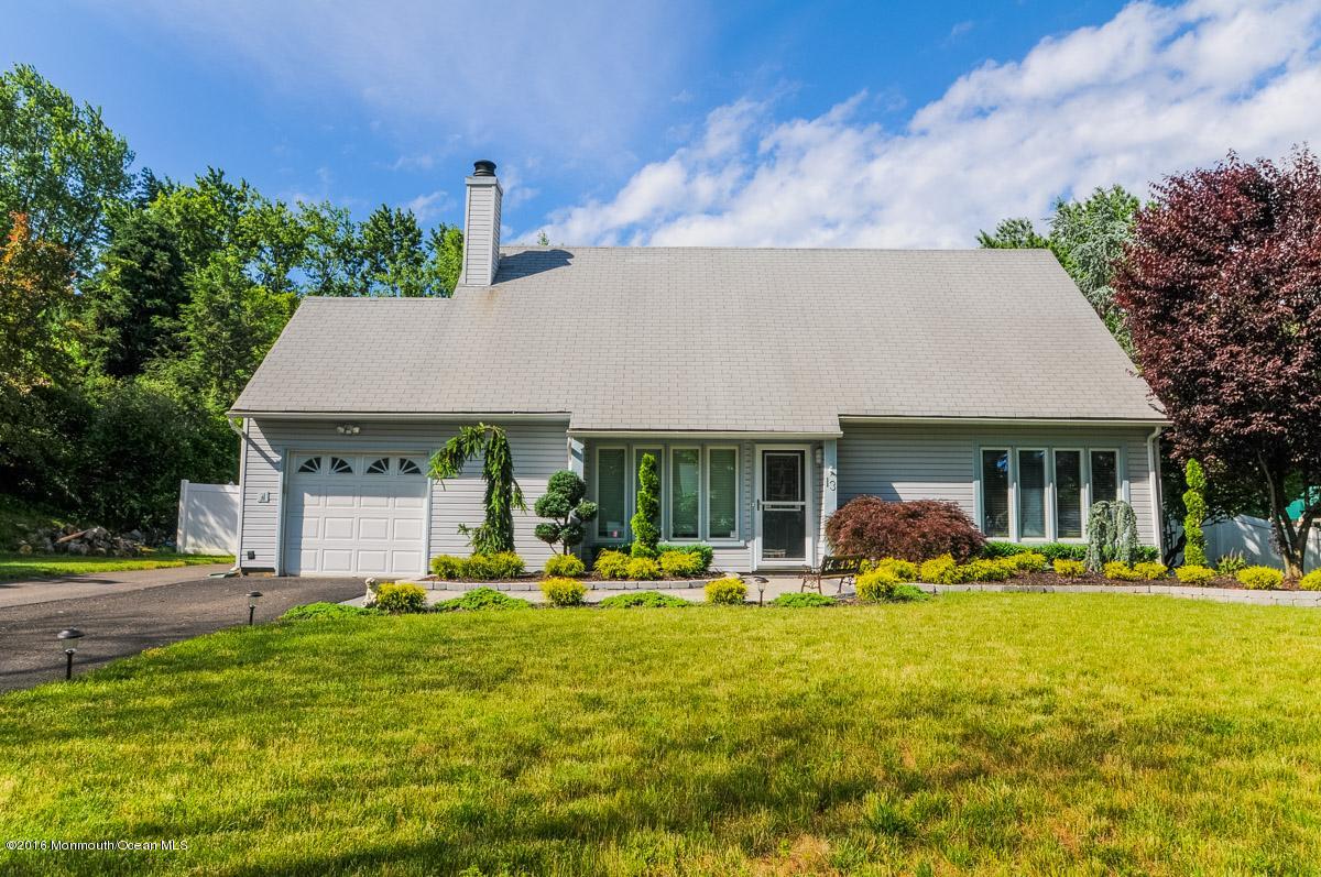 13 Valley Road Manalapan, NJ 07726 - Photo 1 of 26 a front view of house with yard and outdoor seating