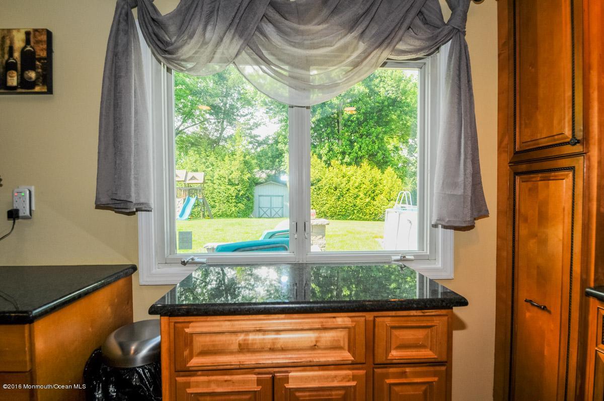 13 Valley Road Manalapan, NJ 07726 - Photo 12 of 26 a window that has a tree in it