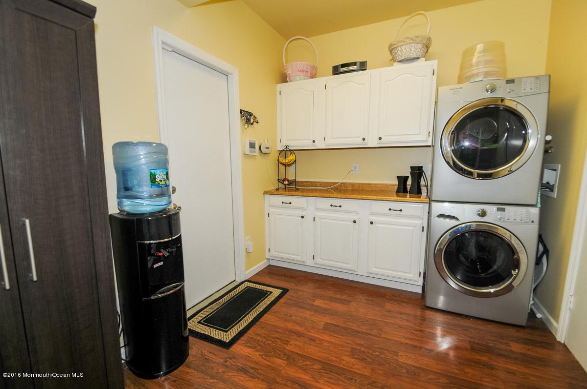 13 Valley Road Manalapan, NJ 07726 - Photo 20 of 26 a view of a kitchen with washer and dryer