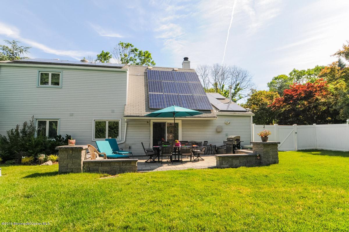 13 Valley Road Manalapan, NJ 07726 - Photo 26 of 26 a front view of house with yard and outdoor seating
