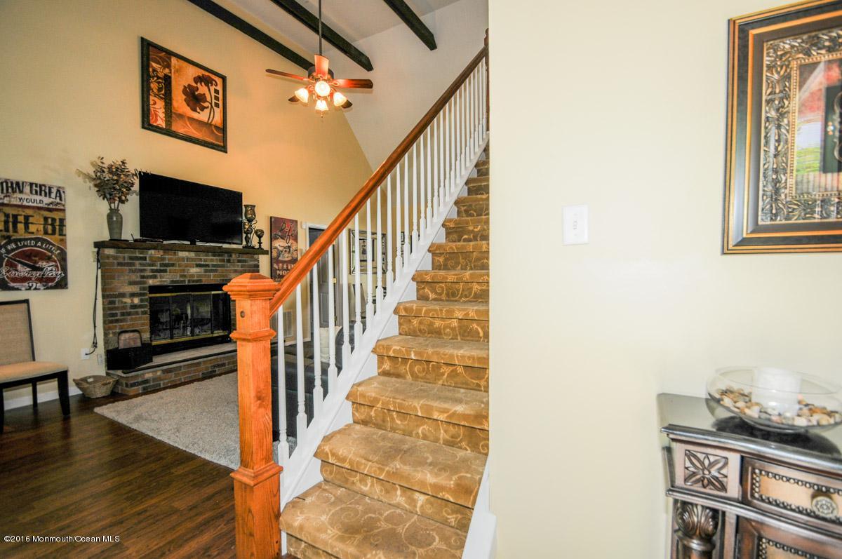 13 Valley Road Manalapan, NJ 07726 - Photo 5 of 26 a view of entryway and hall with wooden floor