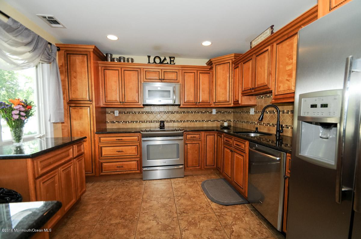 13 Valley Road Manalapan, NJ 07726 - Photo 10 of 26 a kitchen with stainless steel appliances a refrigerator sink and stove