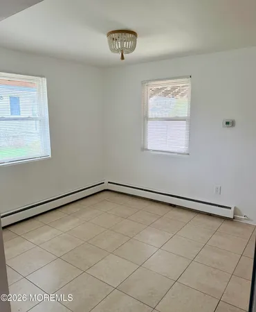 a view of an empty room and a window