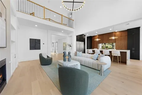 a living room with fireplace furniture and a flat screen tv