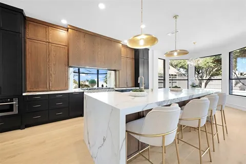 a kitchen with a table and chairs in it