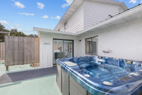 a kitchen with kitchen island granite countertop a sink and a stove
