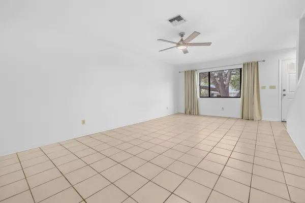 a view of an empty room and window