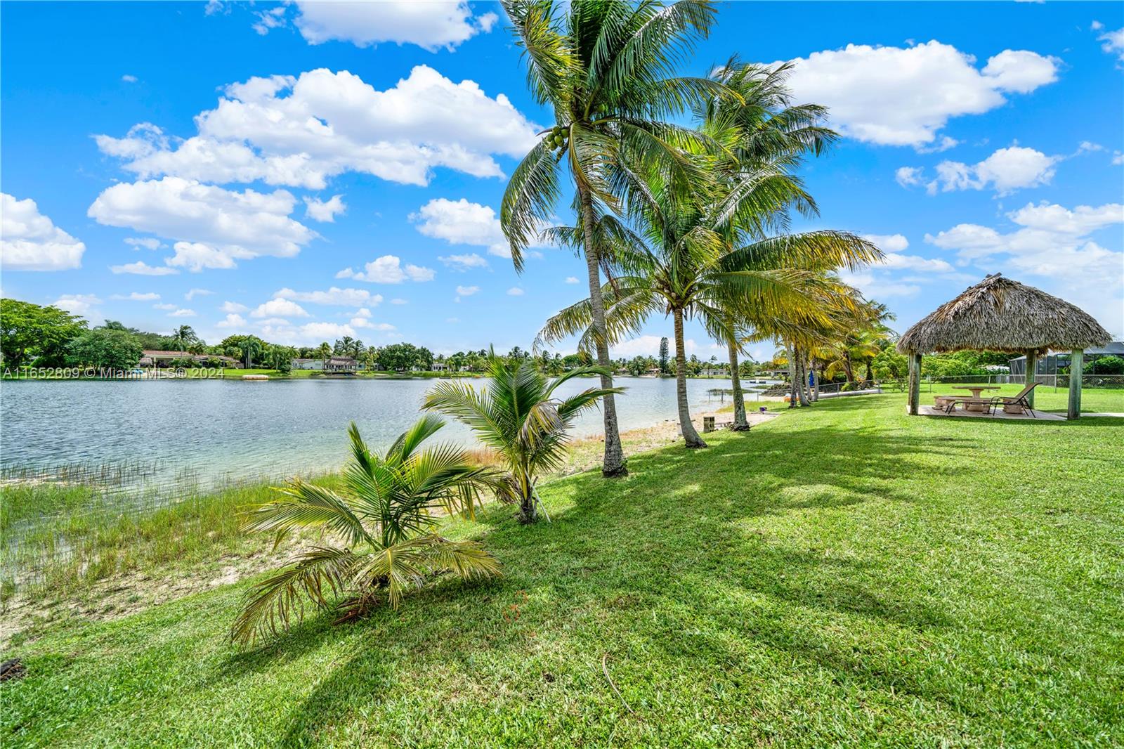 10962 Southwest 117th Street Miami, FL 33176 - Photo 11 of 42 a view of a lake with houses in the back