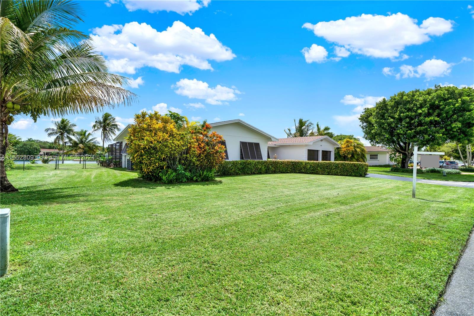 10962 Southwest 117th Street Miami, FL 33176 - Photo 15 of 42 a view of a house with a backyard