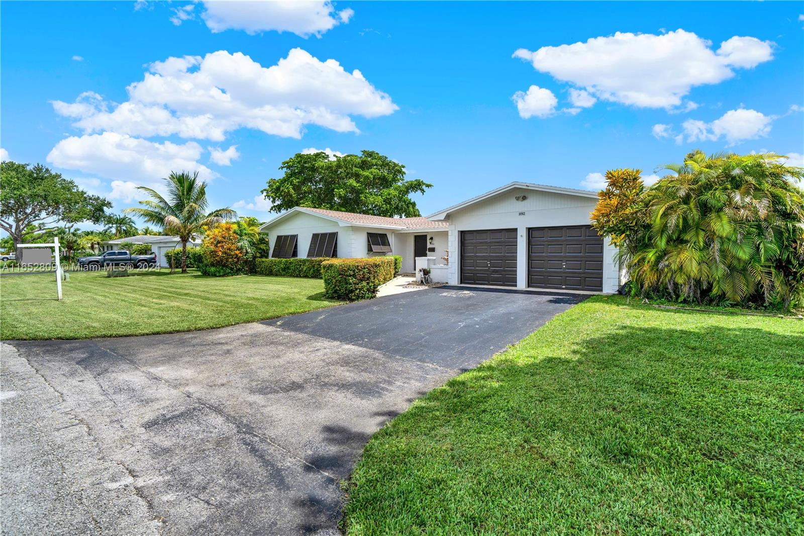 10962 Southwest 117th Street Miami, FL 33176 - Photo 16 of 42 a view of a house with a yard