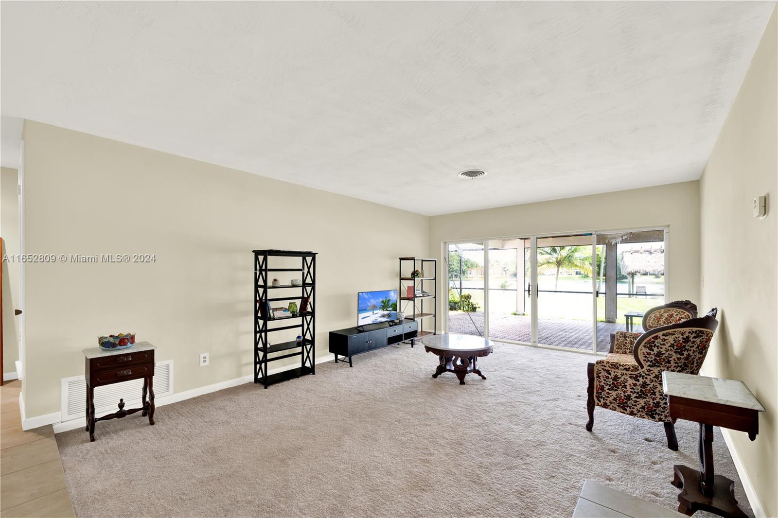 10962 Southwest 117th Street Miami, FL 33176 - Photo 19 of 42 a living room with furniture and a window