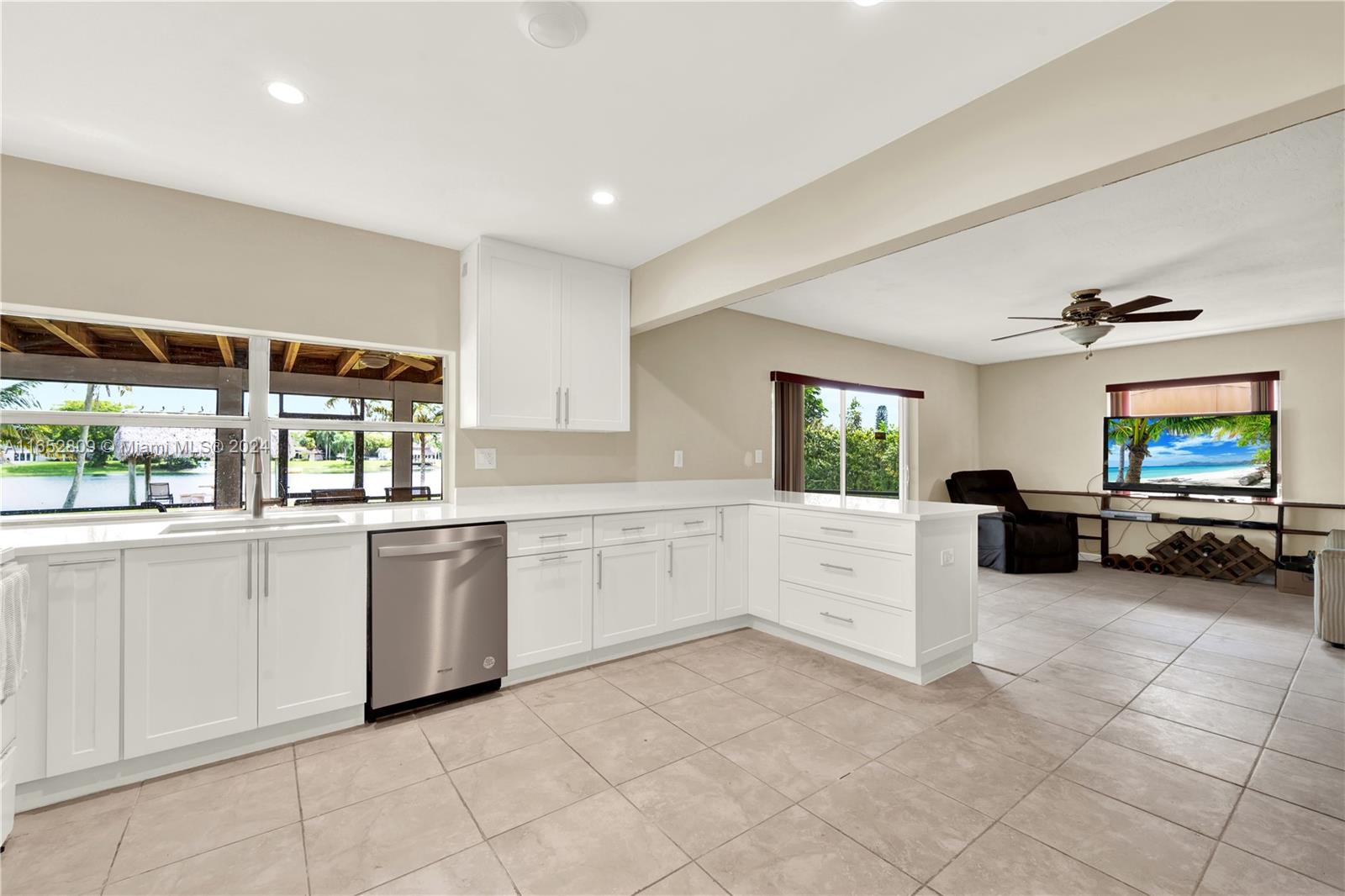 10962 Southwest 117th Street Miami, FL 33176 - Photo 22 of 42 a kitchen with white cabinets and white appliances
