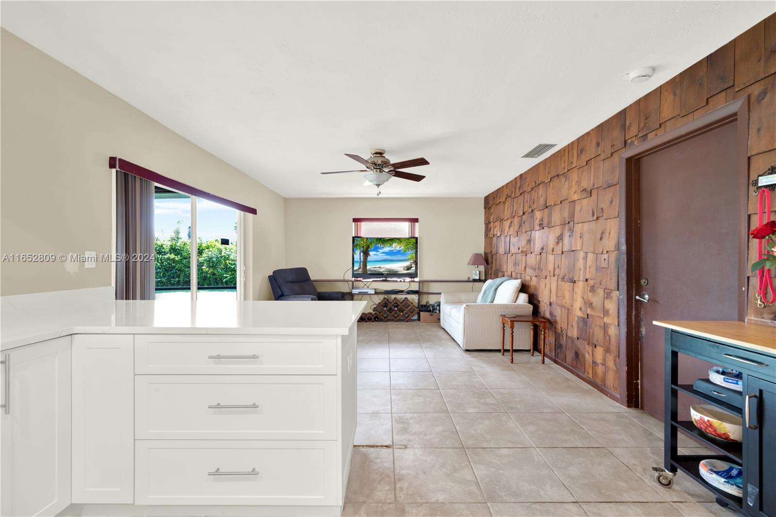 10962 Southwest 117th Street Miami, FL 33176 - Photo 23 of 42 a living room with furniture and a large window