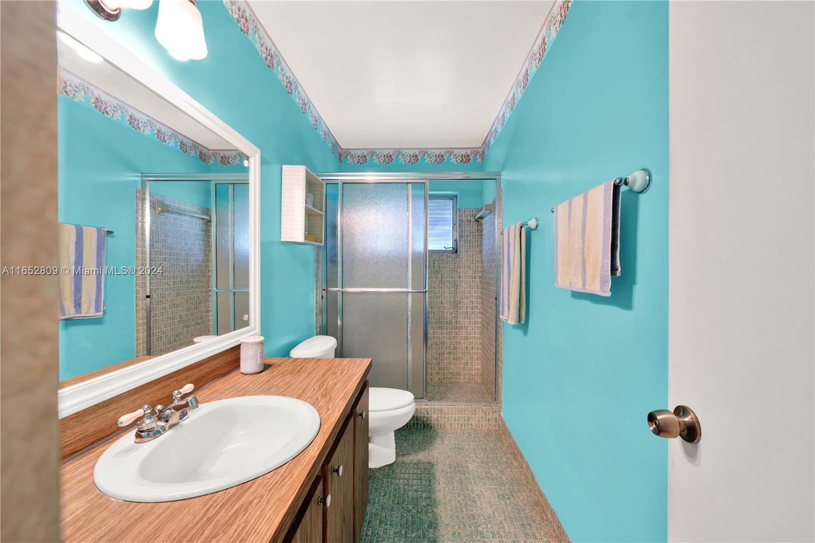 10962 Southwest 117th Street Miami, FL 33176 - Photo 26 of 42 a bathroom with a sink and mirror