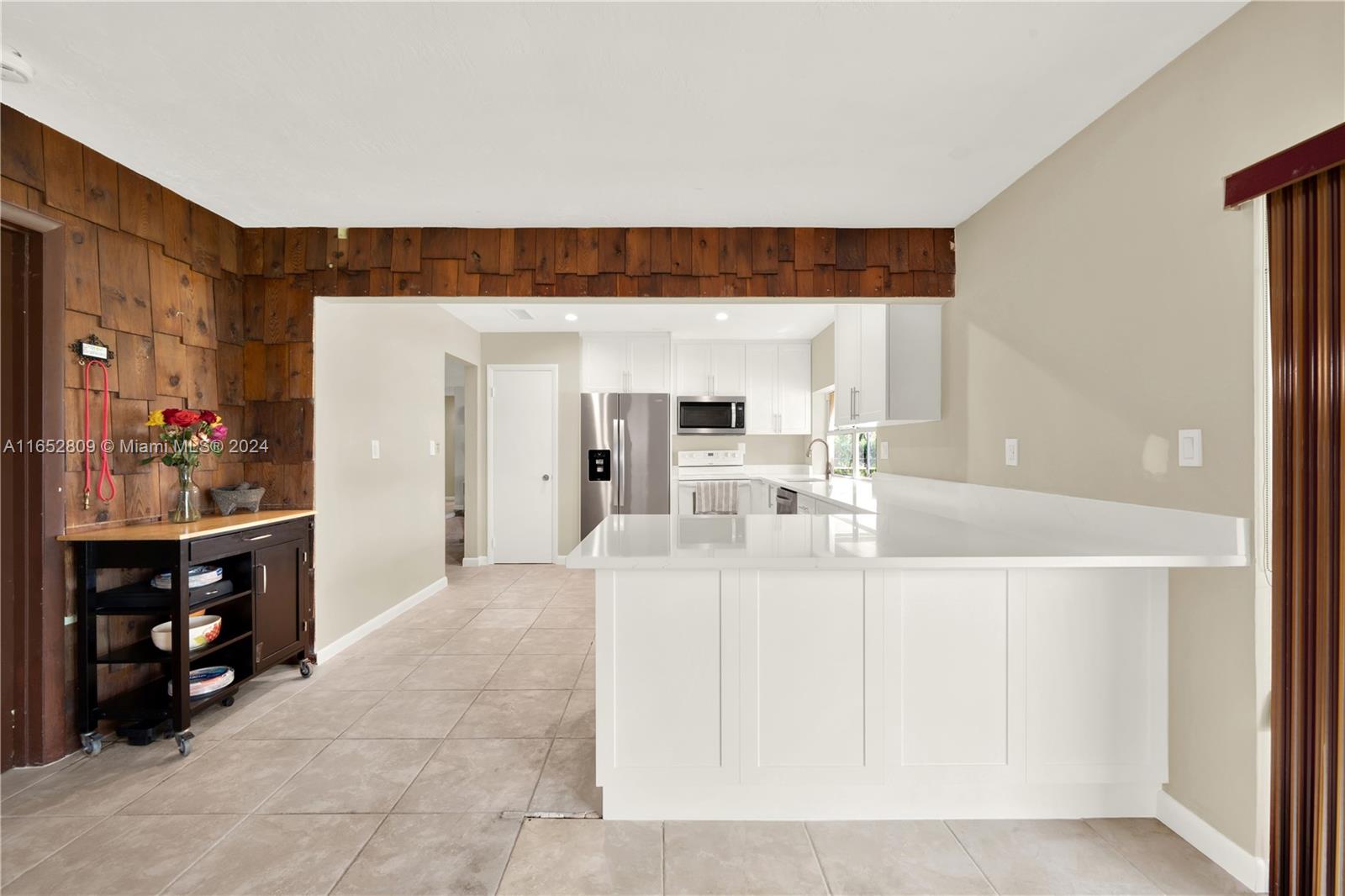 10962 Southwest 117th Street Miami, FL 33176 - Photo 27 of 42 a living room with furniture a wooden floor and next to a window