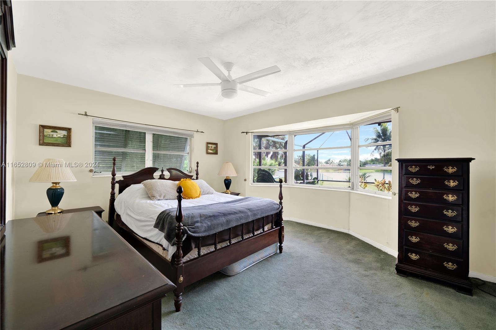 10962 Southwest 117th Street Miami, FL 33176 - Photo 29 of 42 a bedroom with a large bed and a window