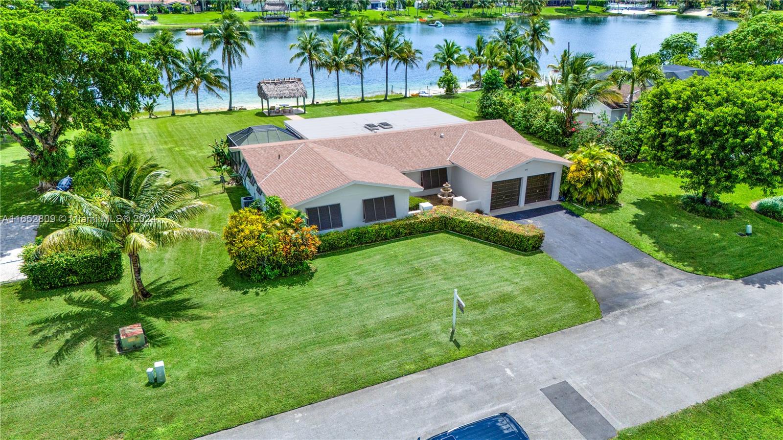 10962 Southwest 117th Street Miami, FL 33176 - Photo 3 of 42 a house that has a lot of plants in it
