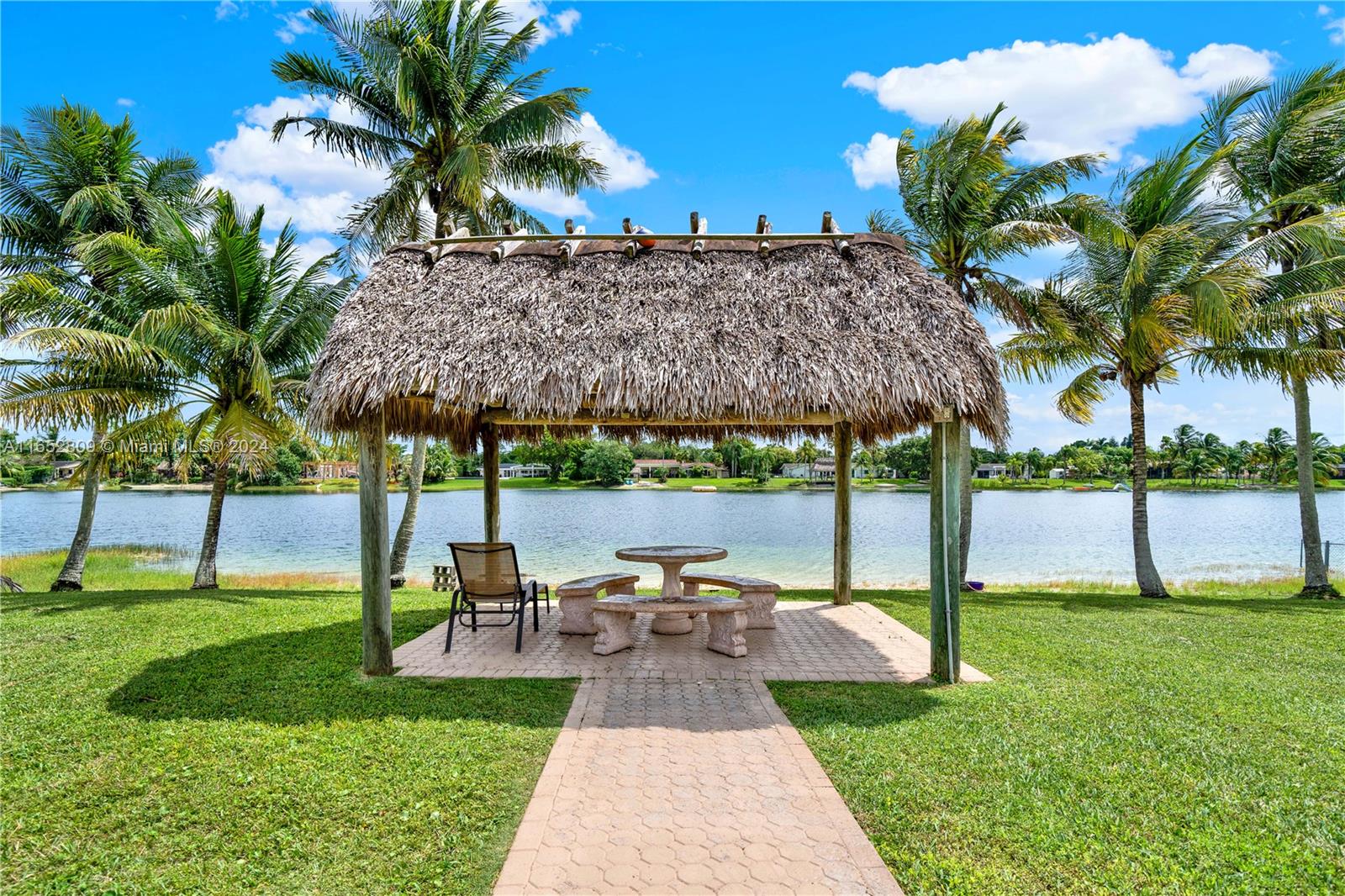 10962 Southwest 117th Street Miami, FL 33176 - Photo 36 of 42 a view of a backyard with swimming pool