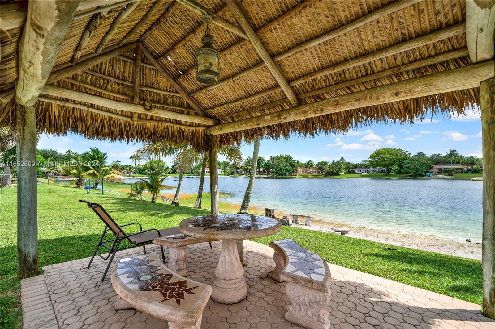 10962 Southwest 117th Street Miami, FL 33176 - Photo 37 of 42 a view of a swimming pool with a patio