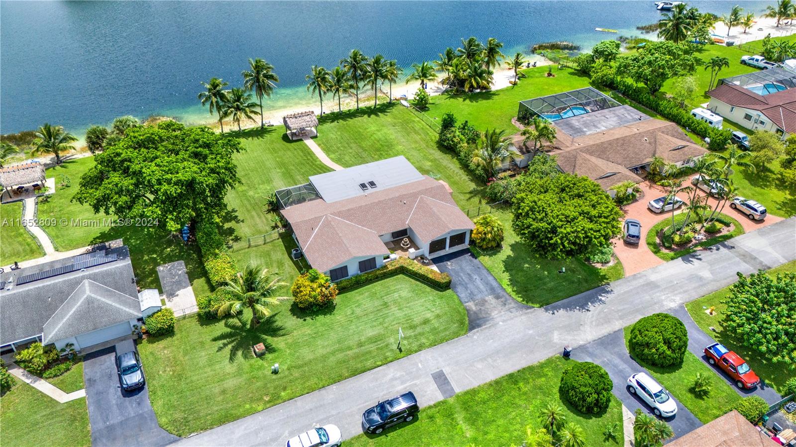 10962 Southwest 117th Street Miami, FL 33176 - Photo 4 of 42 an aerial view of a house with a yard