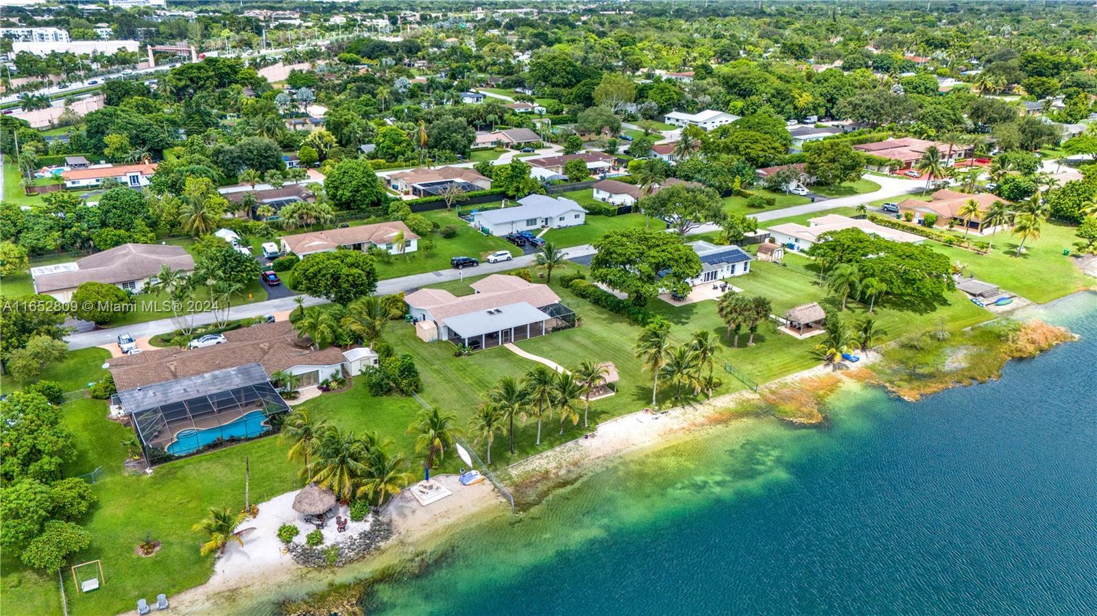 10962 Southwest 117th Street Miami, FL 33176 - Photo 8 of 42 an aerial view of residential house with outdoor space and trees all around