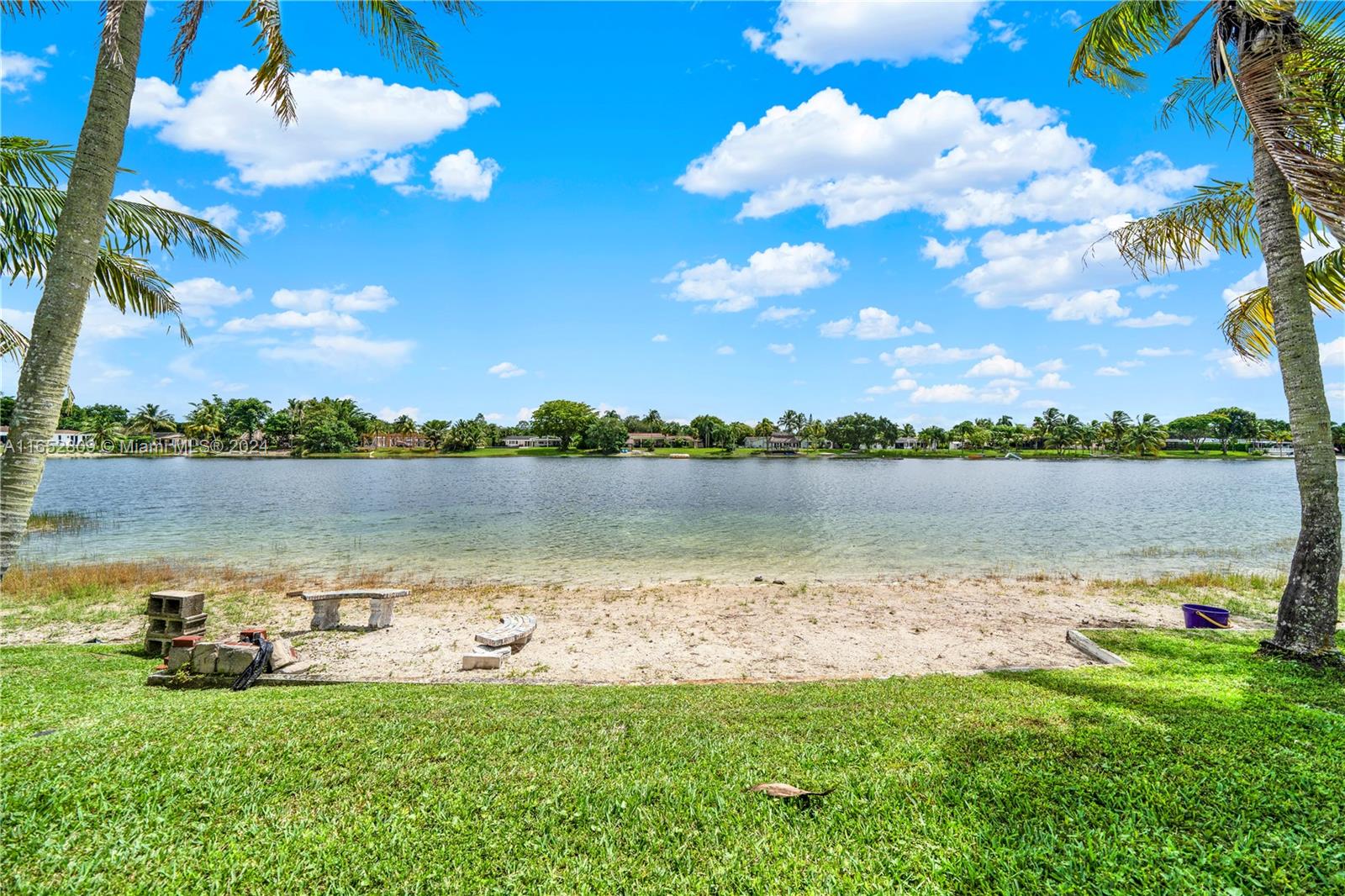 10962 Southwest 117th Street Miami, FL 33176 - Photo 9 of 42 a view of a lake with houses in the back