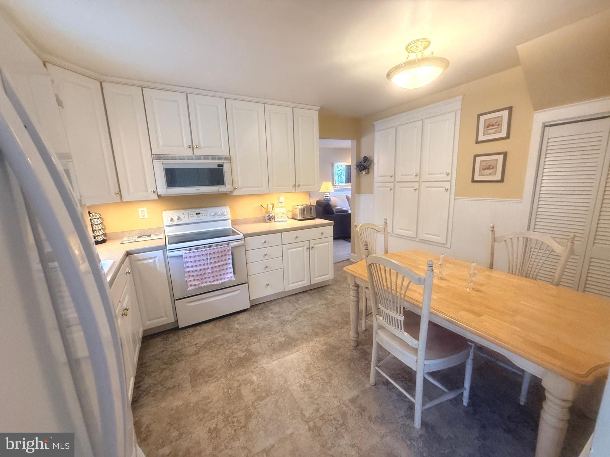 2343 Hancock Drive Lancaster, PA 17601 - Photo 12 of 41 a large white kitchen with sink and wooden floor