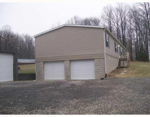 Other. Side view of house and 2 car integral garage!