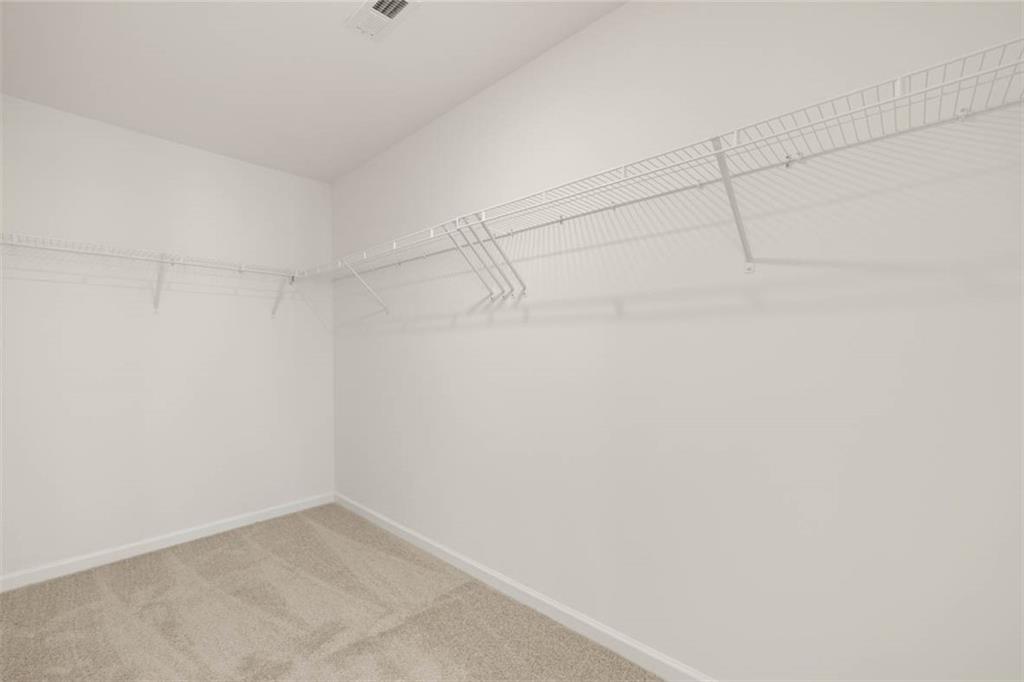 11924 Aukerman Way Hampton, GA 30228 - Photo 17 of 25 a view of a room with racks on the wall