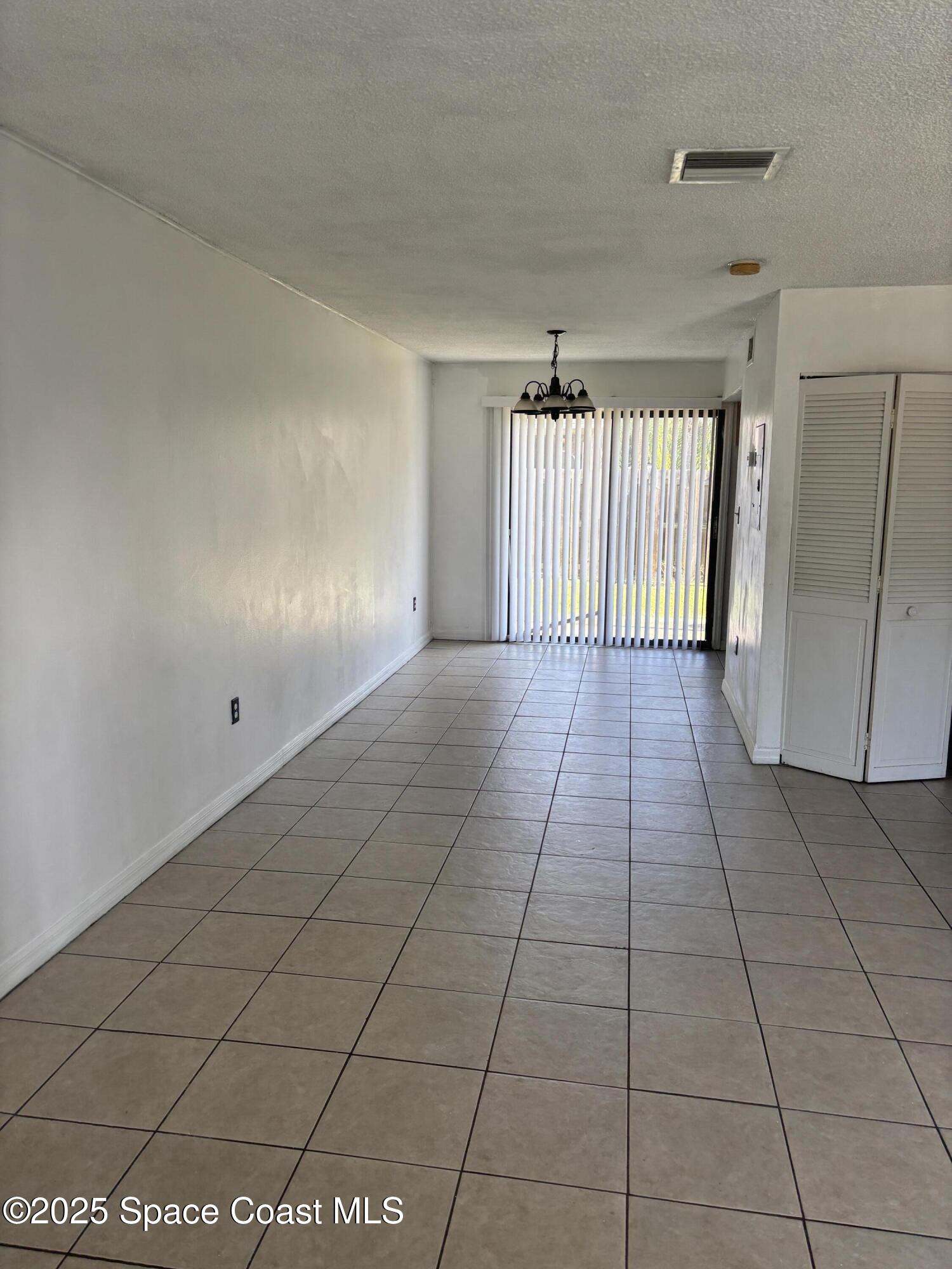 1301 Arlington Lane, Unit 111 Palm Bay, FL 32905 - Photo 14 of 18 a view of a livingroom with a staircase