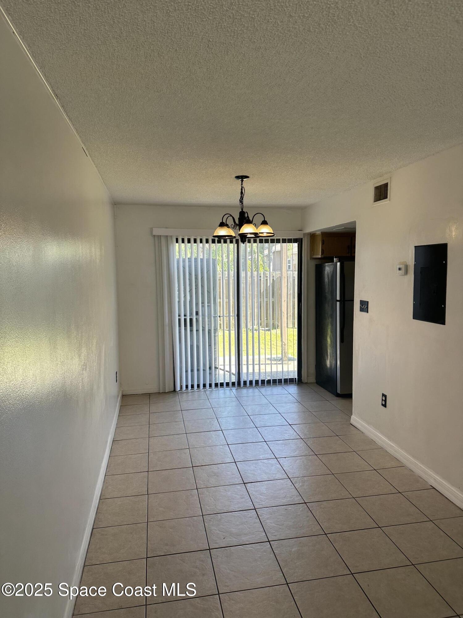 1301 Arlington Lane, Unit 111 Palm Bay, FL 32905 - Photo 15 of 18 a view of an empty room and window