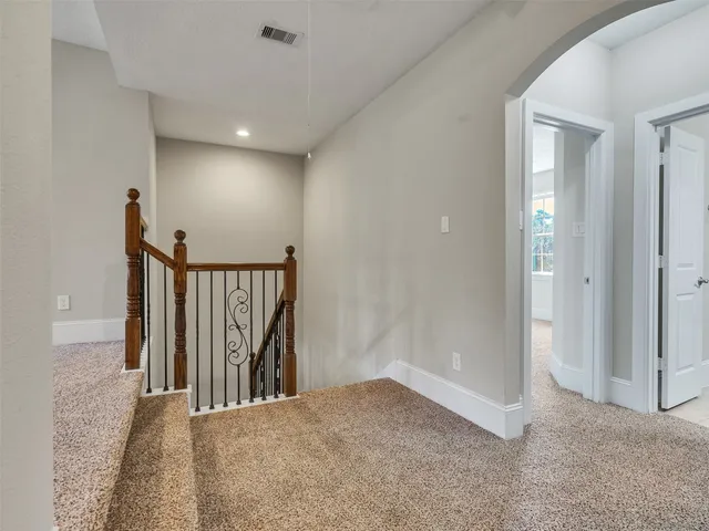 a bathroom with a granite countertop bathtub shower
