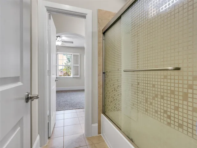 a bathroom with a sink mirror toilet and bathtub