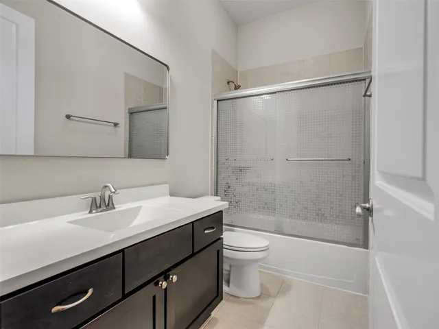 a view of a yard with plants and trees