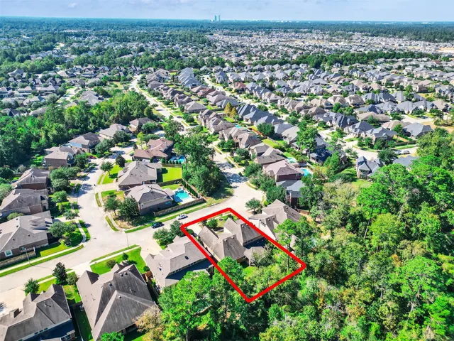 an aerial view of a house with garden