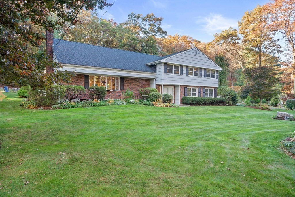 17 Mohawk Road Canton, MA 02021 - Photo 1 of 40 a front view of a house with a garden