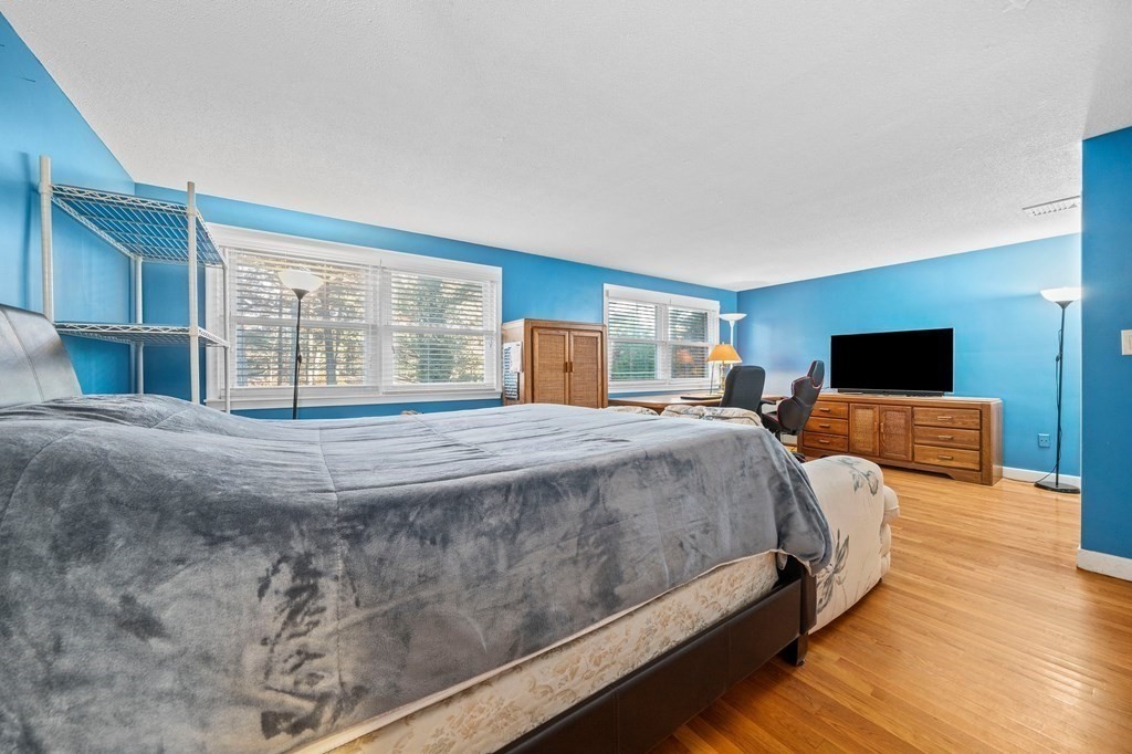 17 Mohawk Road Canton, MA 02021 - Photo 23 of 40 a spacious bedroom with a bed and wooden floor