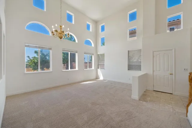 a view of livingroom with furniture flat screen tv and window