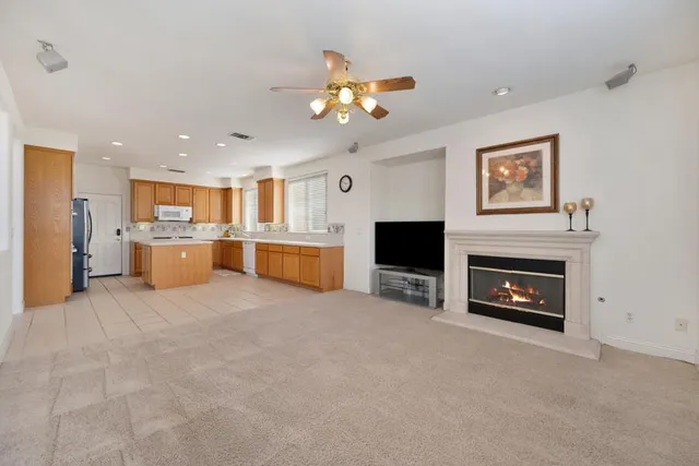 a kitchen with stainless steel appliances granite countertop a stove top oven sink and cabinets