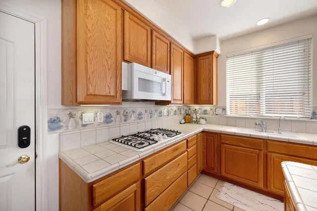 a view of a livingroom with workspace and a window