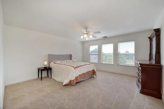 a bathroom with a granite countertop sink mirror and shower